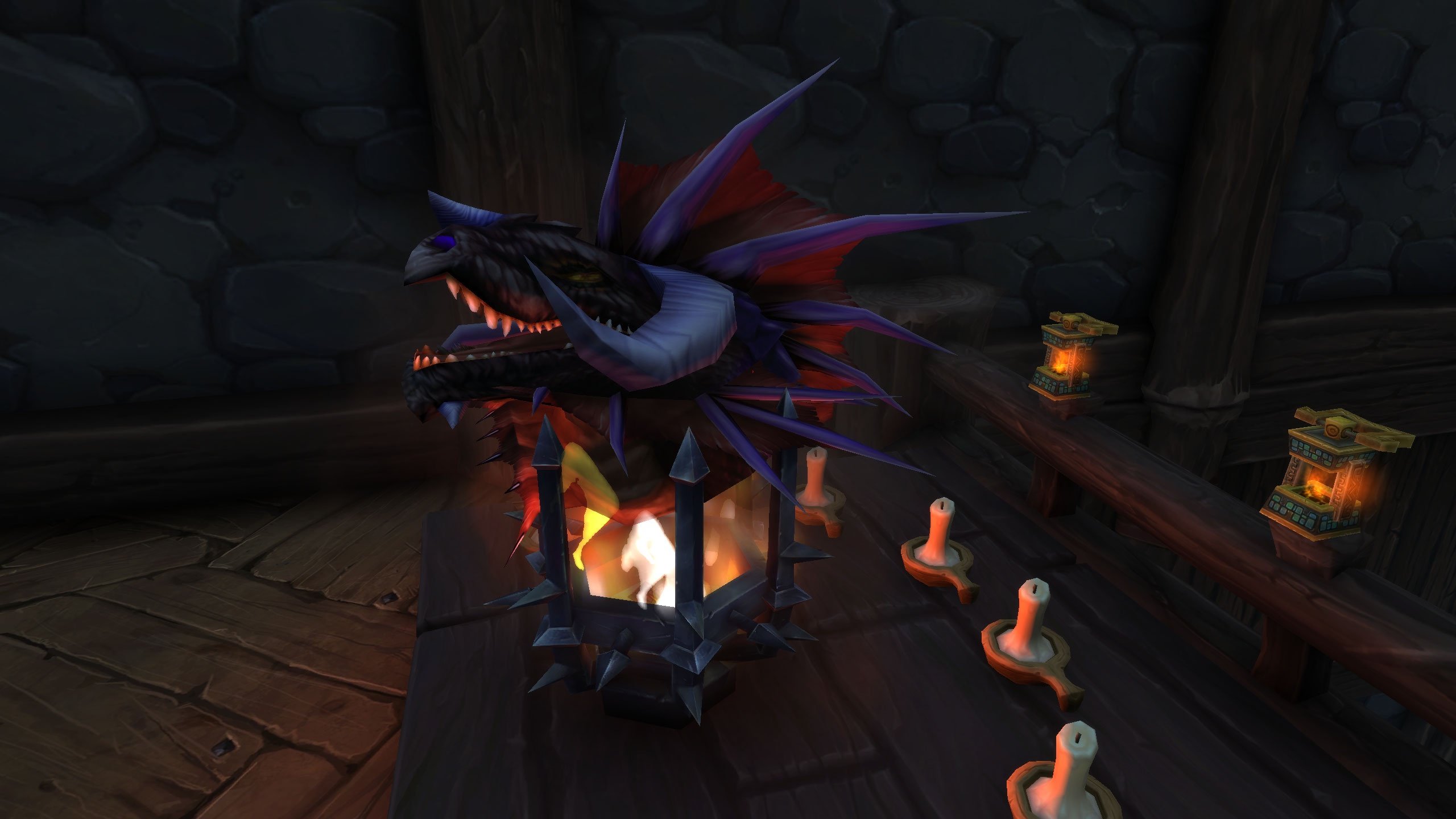 Close-up of a WoW Housing Onyxia trophy mounted above candles and lanterns, showing collectible decor customization.