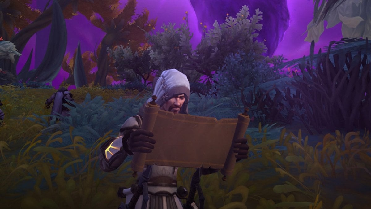 A man reading a parchment in WoW.